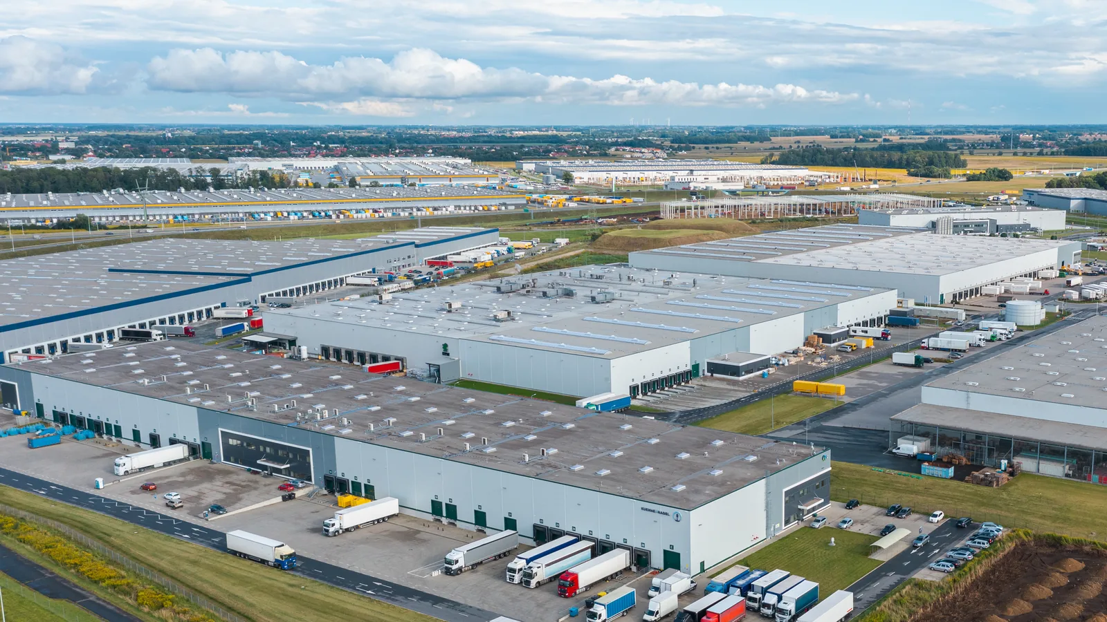 Aerial view of a large industrial facility and loading areas